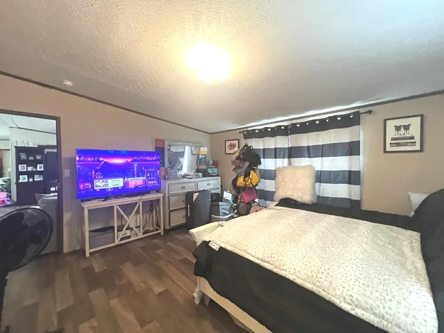 a bathroom with a sink mirror vanity and toilet