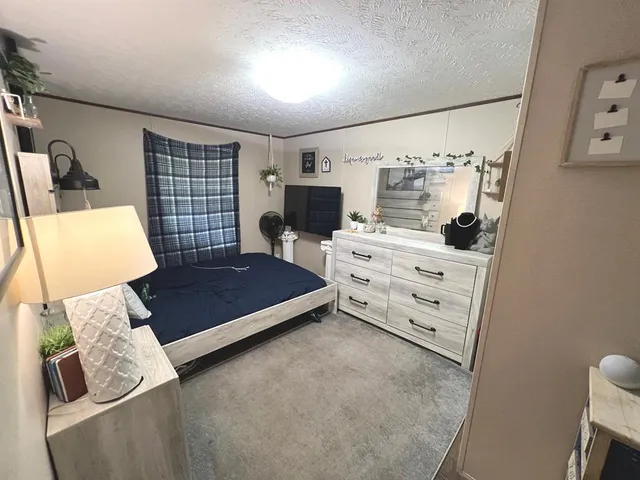 a living room with furniture gym equipment and a flat screen tv