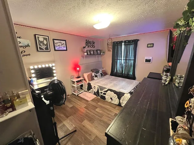 a bed room with a bed and a dresser