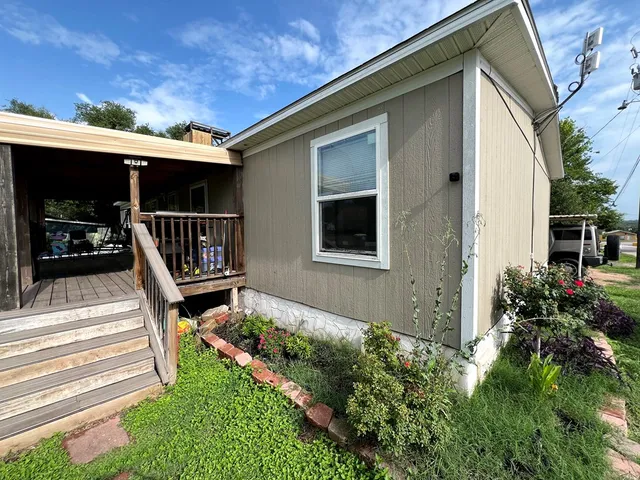 a house with garden in front of it