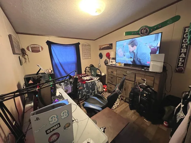 a bedroom with a bed and a couch