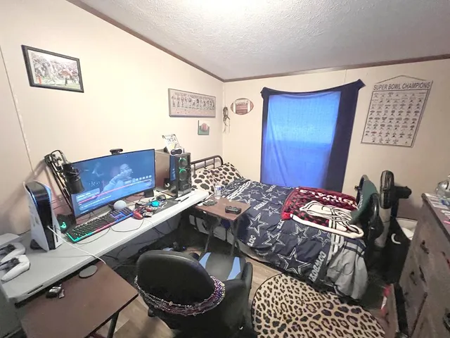 a utility room with lots of clutter and bicycles