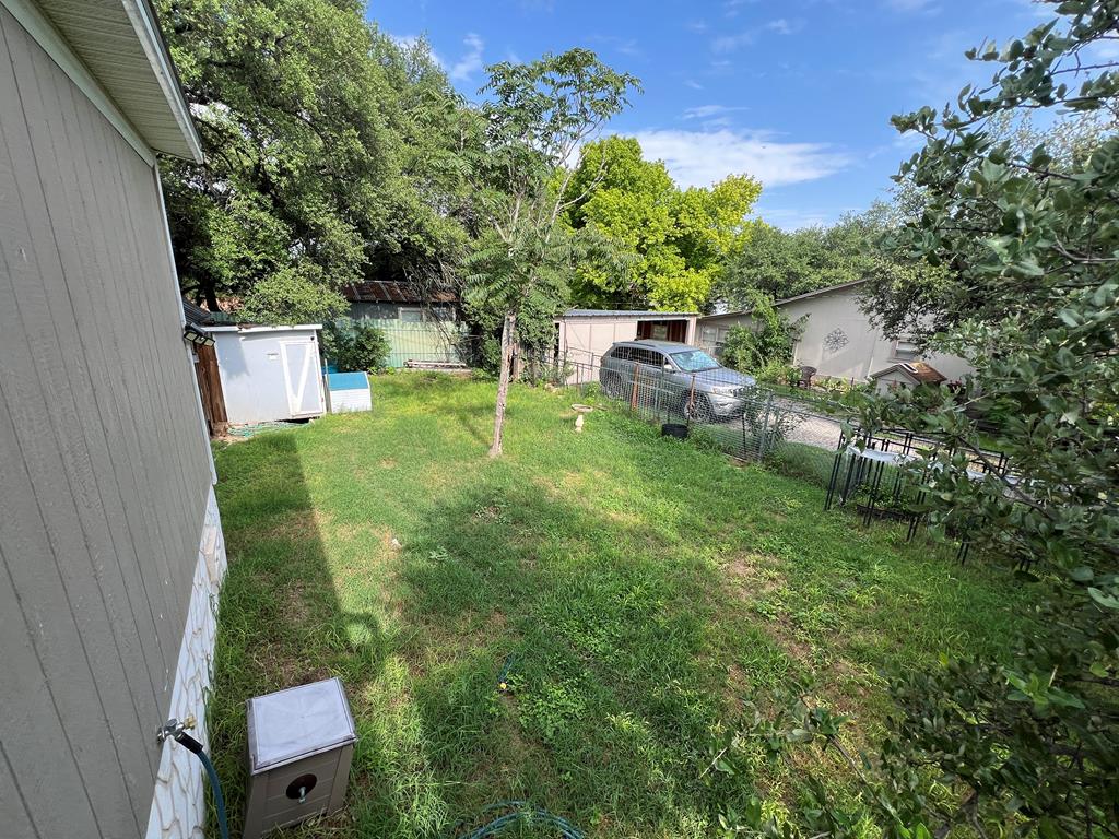 138 3rd Street Harper, TX 78631 - Photo 27 of 32 a backyard of a house with lots of green space