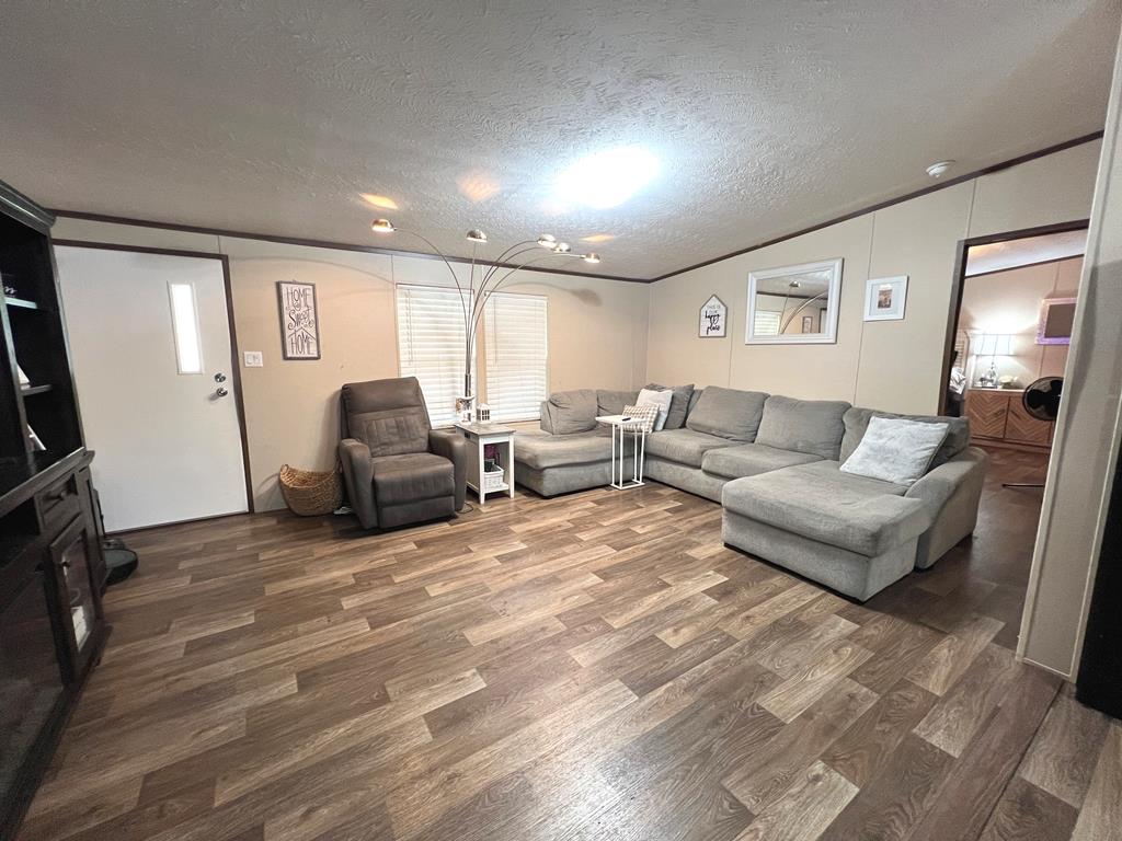 138 3rd Street Harper, TX 78631 - Photo 5 of 32 a living room with furniture and a flat screen tv