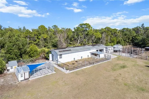 view of backyard with swimming pool and outdoor seating