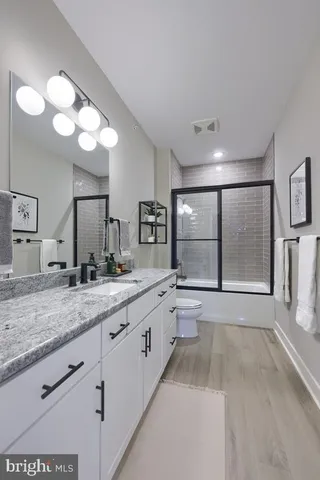 a large white kitchen with a large window