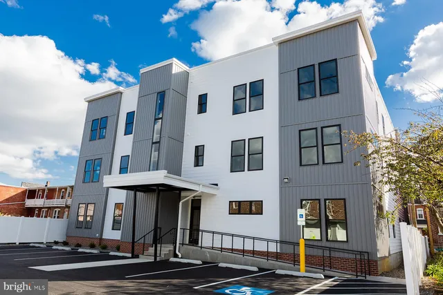 a front view of a multi story residential apartment building