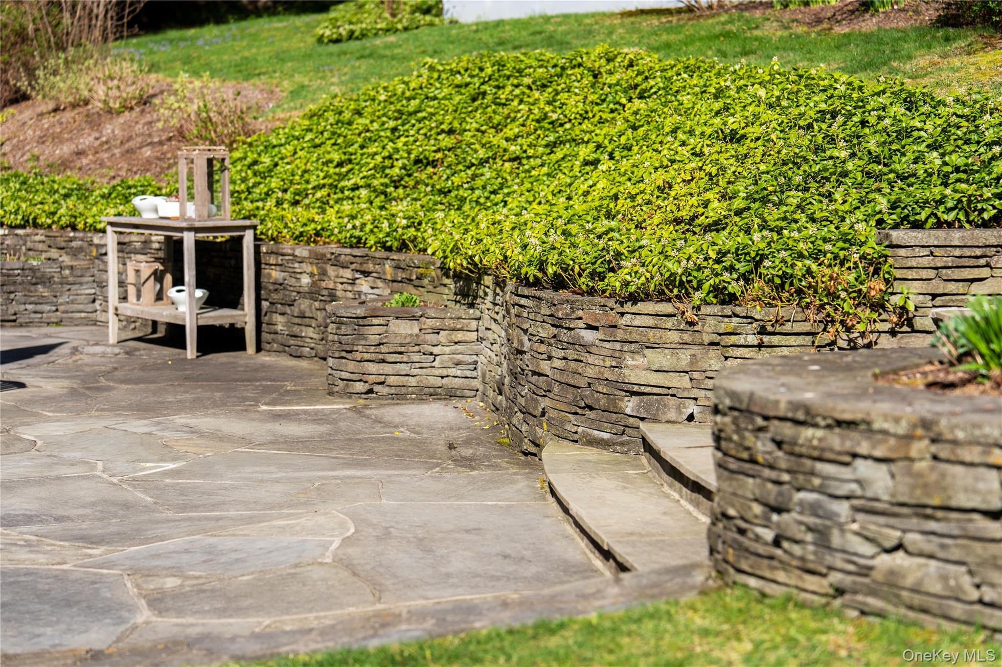 14 Aldridge Road Chappaqua, NY 10514 - Photo 6 of 38 Expansive slate patio and stacked stone knee walls
