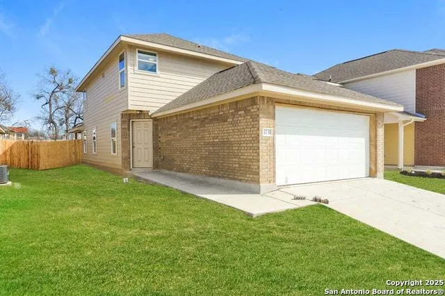 a view of a backyard of the house