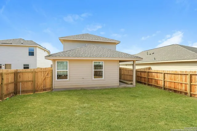 a view of a backyard of the house