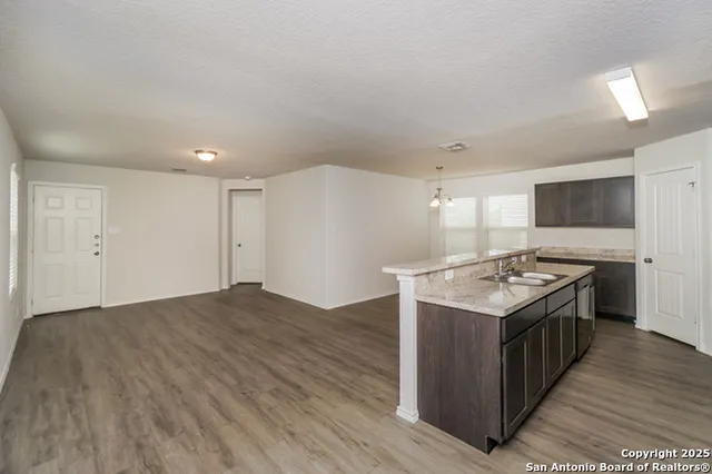 a kitchen with a sink and cabinets