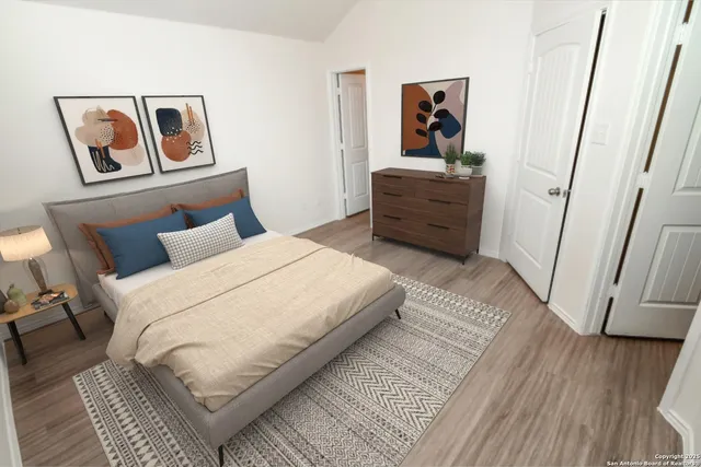 a bedroom with a bed and a mirror