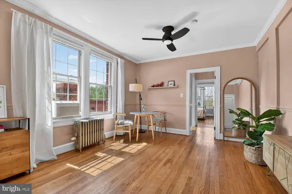 a view of a livingroom with furniture and hardwood floor