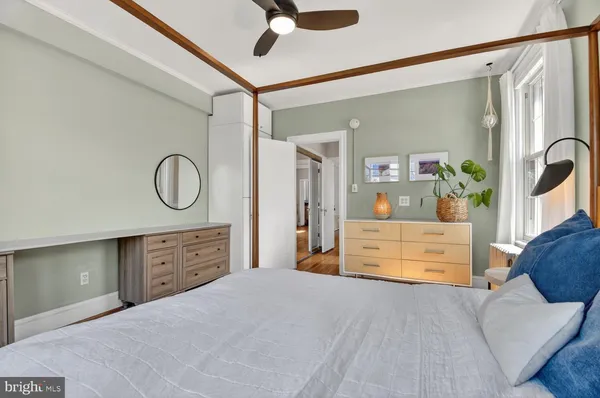a bedroom with a bed dresser and a dresser