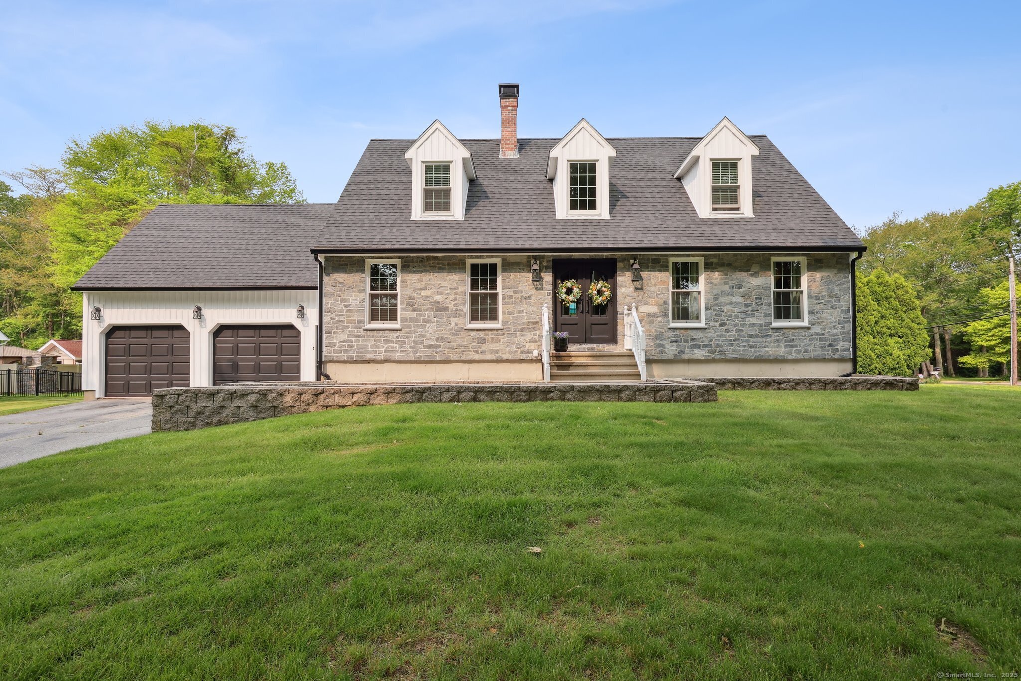 front view of a house with a yard