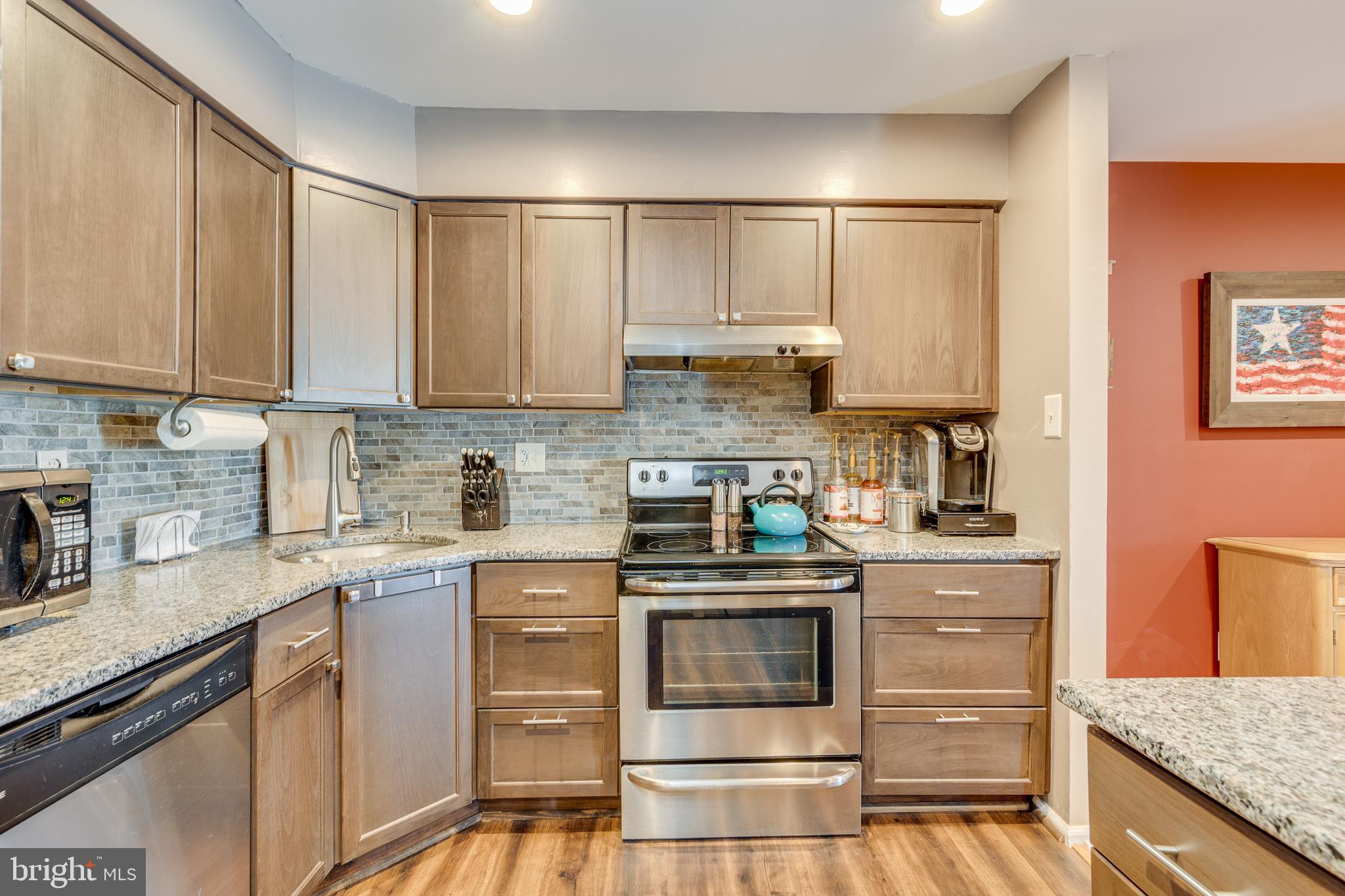 88 B Red Cedar Court Mount Laurel, NJ 08054 - Photo 11 of 19 a kitchen with stainless steel appliances granite countertop a stove a sink and white cabinets