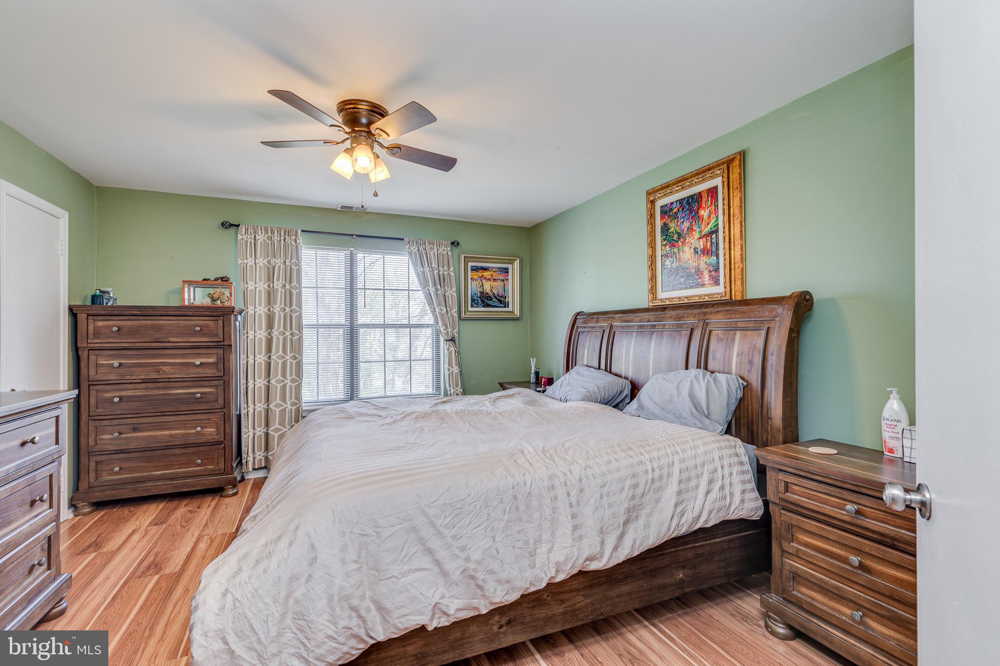 88 B Red Cedar Court Mount Laurel, NJ 08054 - Photo 15 of 19 a bedroom with a bed and a chandelier