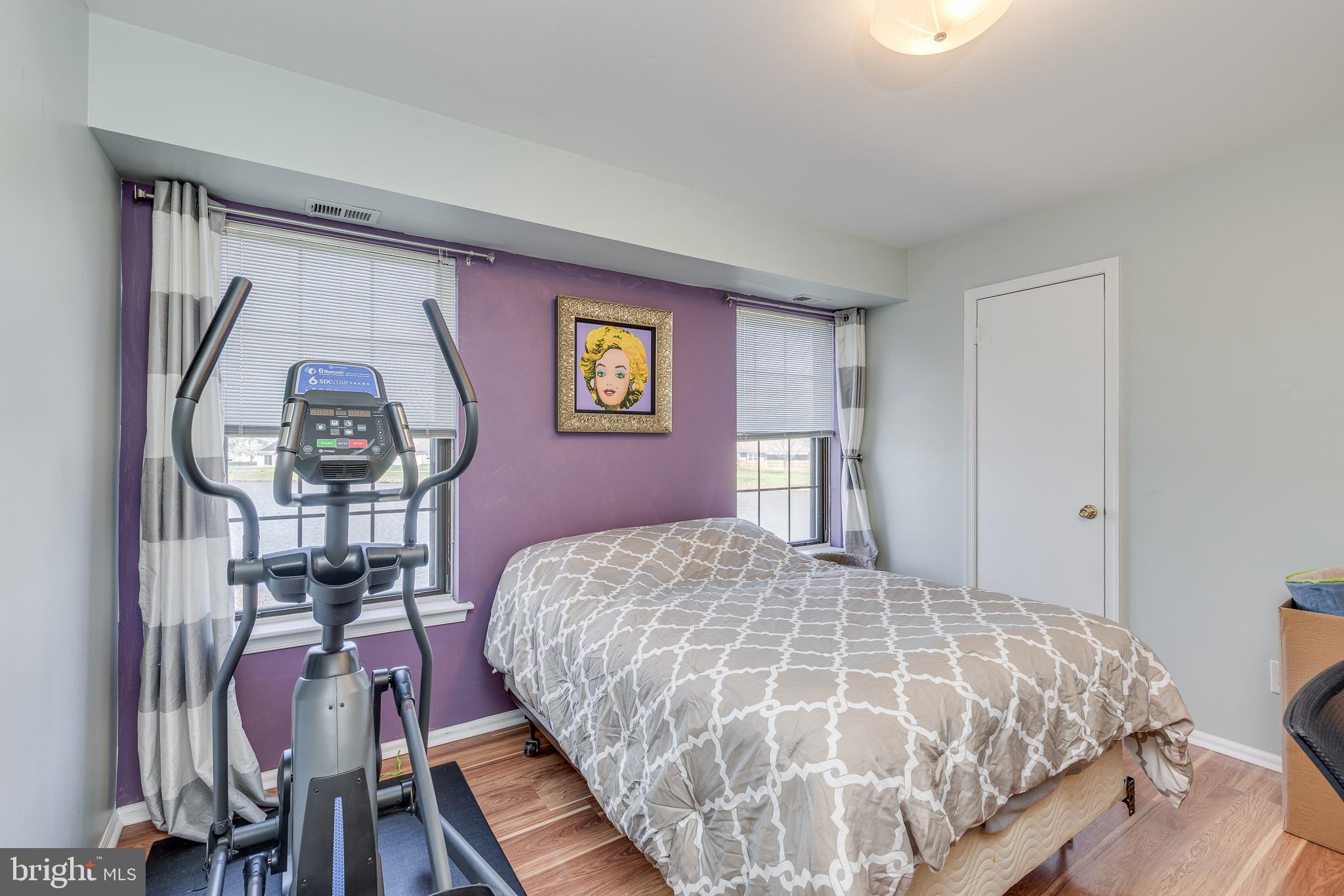88 B Red Cedar Court Mount Laurel, NJ 08054 - Photo 17 of 19 a bed sitting in a bedroom next to a window