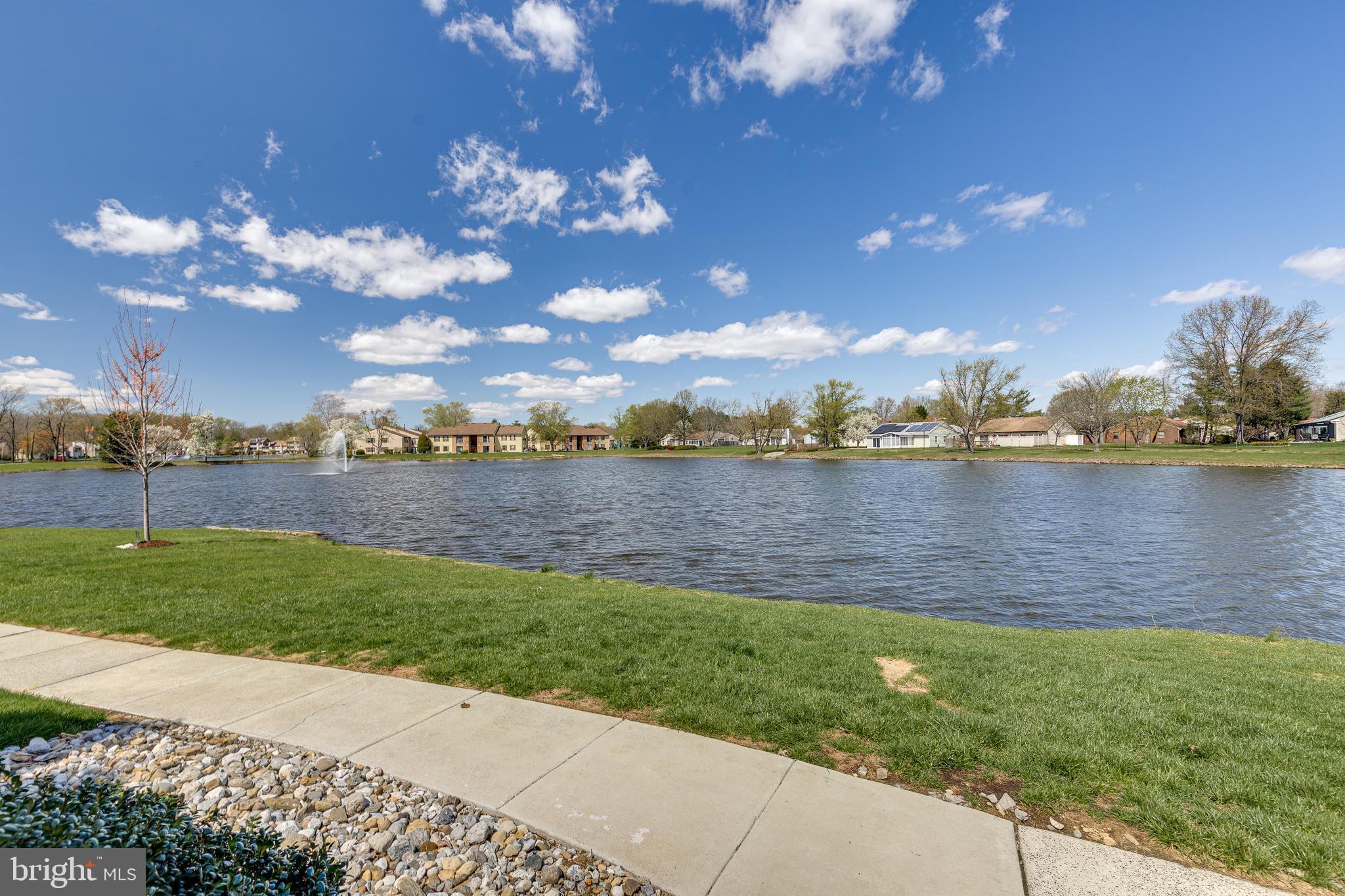 88 B Red Cedar Court Mount Laurel, NJ 08054 - Photo 18 of 19 a view of a lake with houses in the back