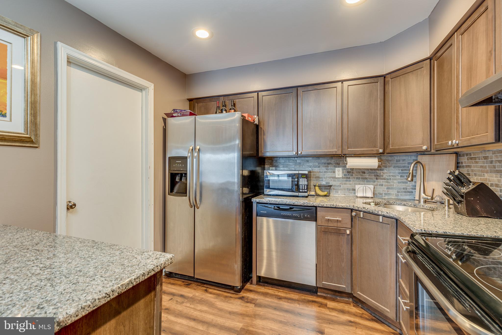 88 B Red Cedar Court Mount Laurel, NJ 08054 - Photo 9 of 19 a kitchen with stainless steel appliances granite countertop a refrigerator and a sink