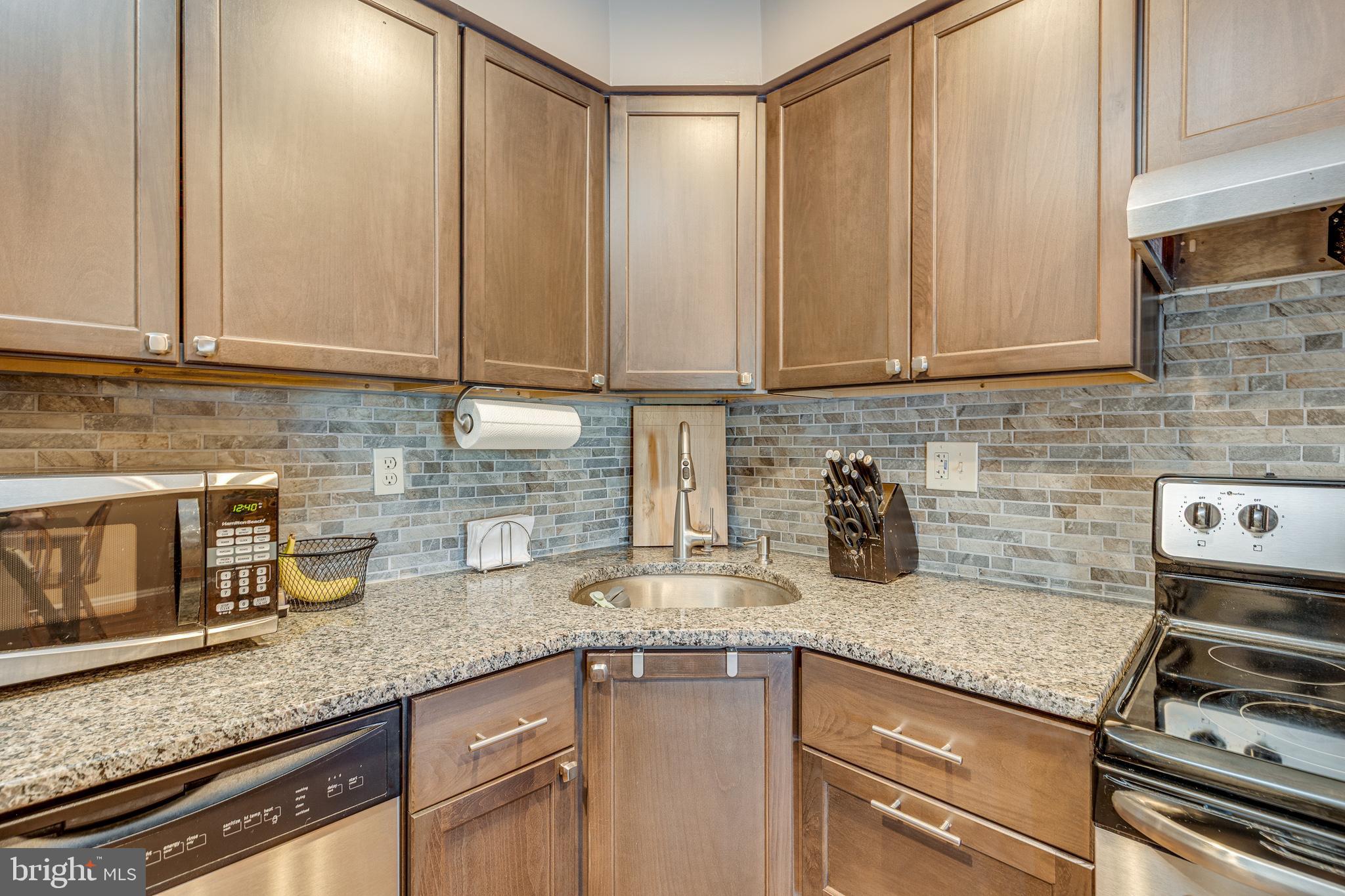 88 B Red Cedar Court Mount Laurel, NJ 08054 - Photo 10 of 19 a kitchen with granite countertop a sink stainless steel appliances and cabinets