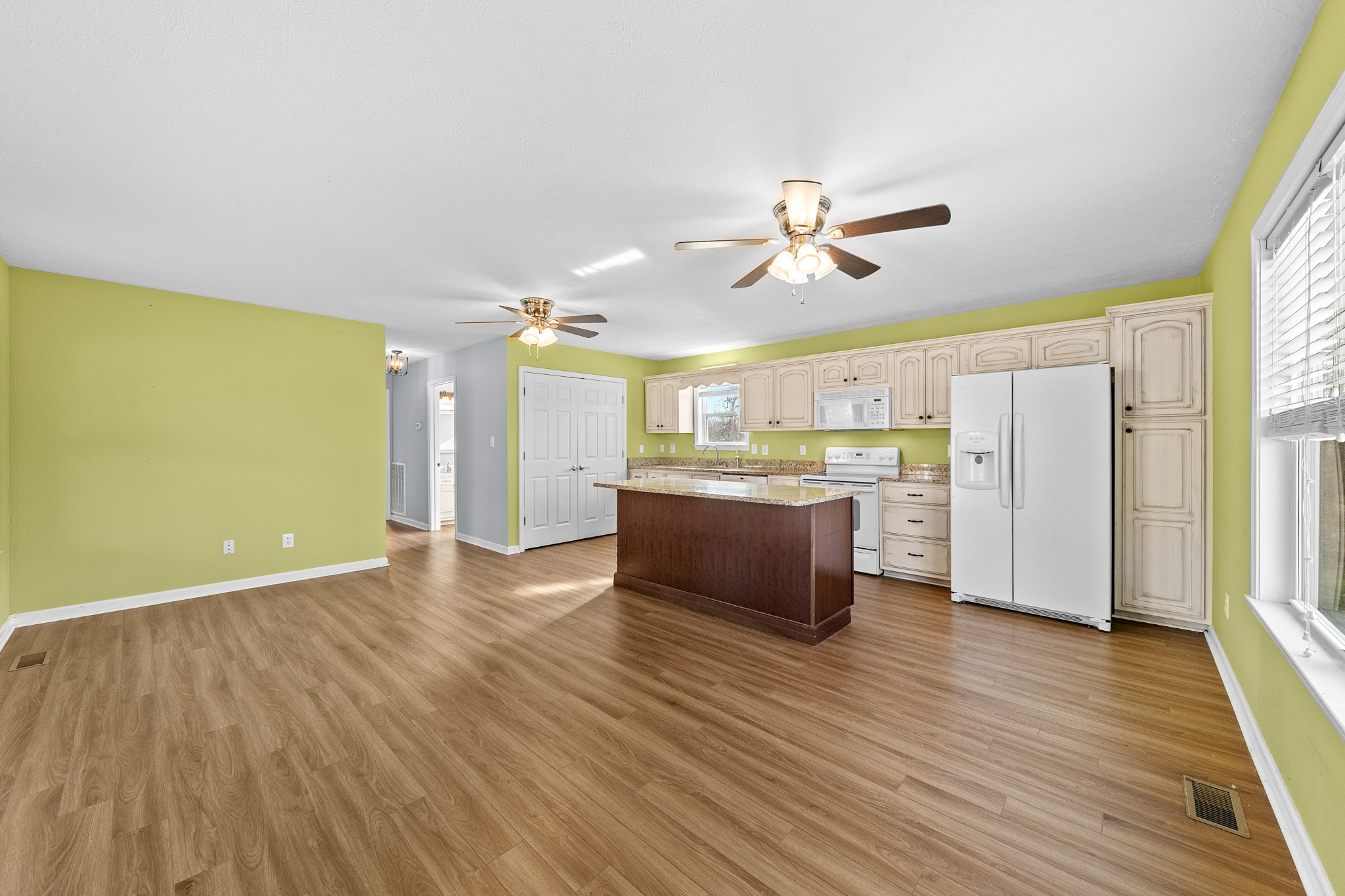 104 Zimmerman Road Hampshire, TN 38461 - Photo 18 of 73 a view of kitchen with cabinets and wooden floor