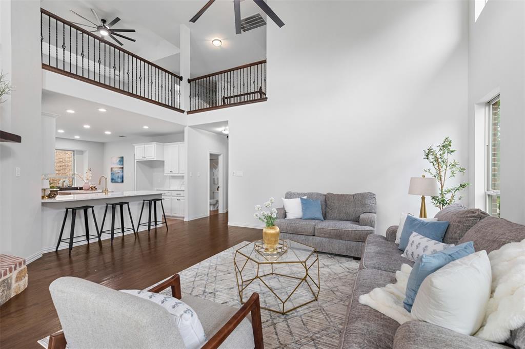 11984 Del Rio Drive Frisco, TX 75035 - Photo 11 of 38 a living room with furniture a table and a potted plant