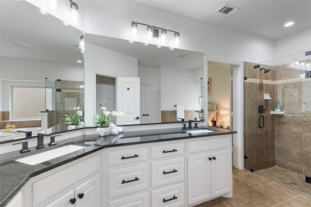 11984 Del Rio Drive Frisco, TX 75035 - Photo 20 of 38 a bathroom with a double vanity sink mirror and shower