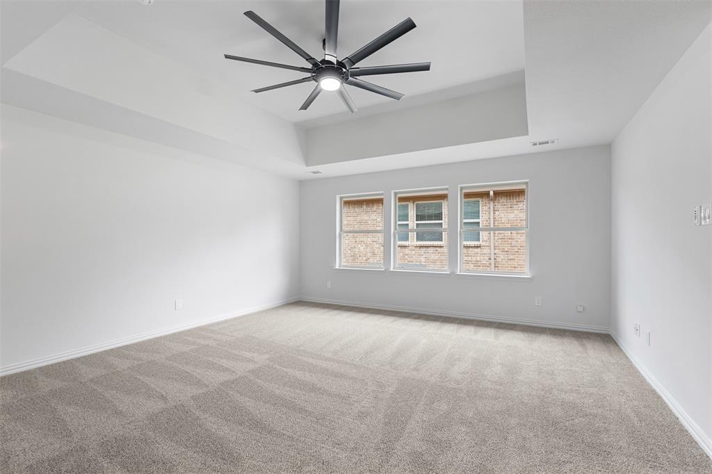 11984 Del Rio Drive Frisco, TX 75035 - Photo 21 of 38 an empty room with a window and a ceiling fan