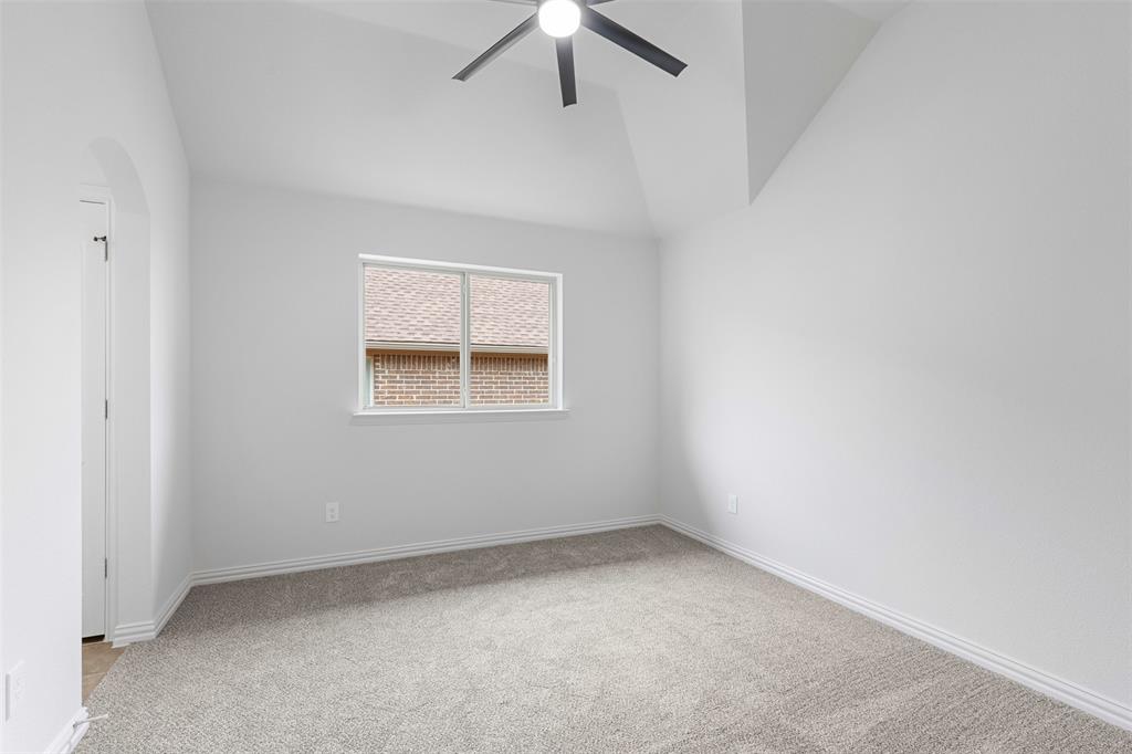 11984 Del Rio Drive Frisco, TX 75035 - Photo 28 of 38 an empty room with a window and a ceiling fan