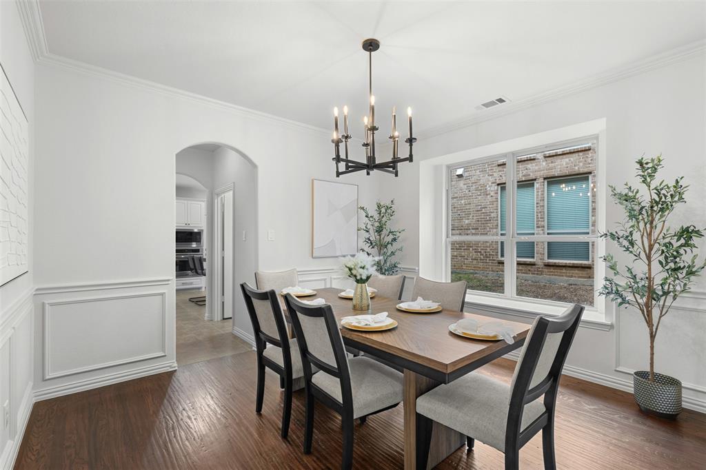 11984 Del Rio Drive Frisco, TX 75035 - Photo 8 of 38 a view of a dining room with furniture window and wooden floor