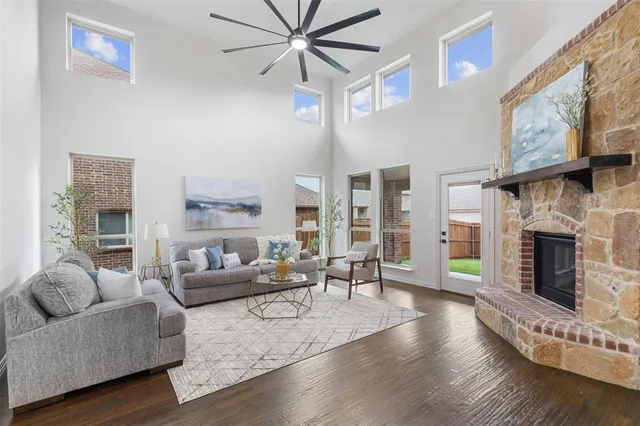 a living room with furniture and a fireplace