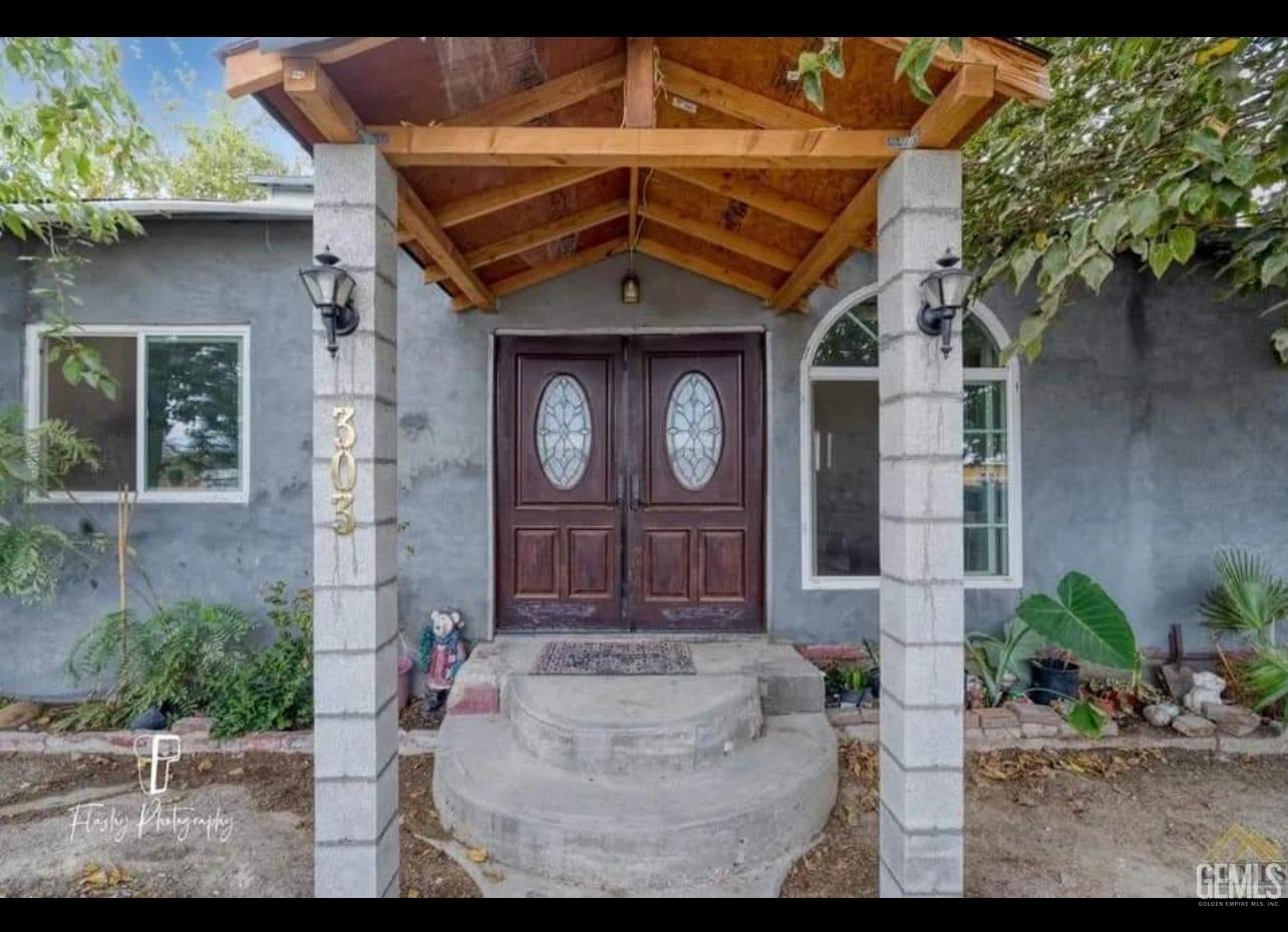 Undisclosed Address Taft, CA 93268 - Photo 1 of 1 a front view of a house with garden