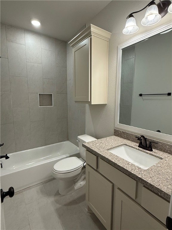 6308 Raleigh Drive College Station, TX 77845 - Photo 12 of 19 Bathroom featuring vanity, a textured wall, and bathtub / shower combination