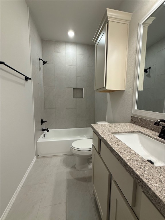 6308 Raleigh Drive College Station, TX 77845 - Photo 14 of 19 Full bath featuring vanity, shower / bathtub combination, and light tile patterned flooring