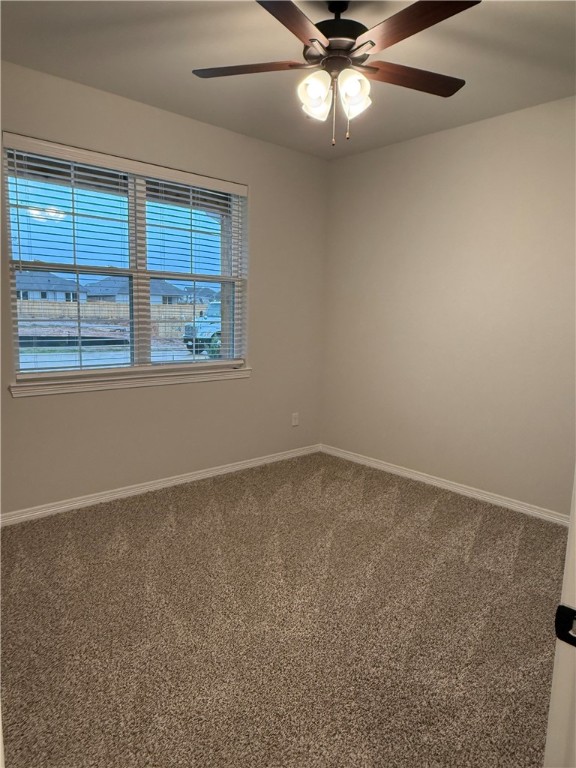 6308 Raleigh Drive College Station, TX 77845 - Photo 10 of 19 Carpeted spare room featuring baseboards and ceiling fan