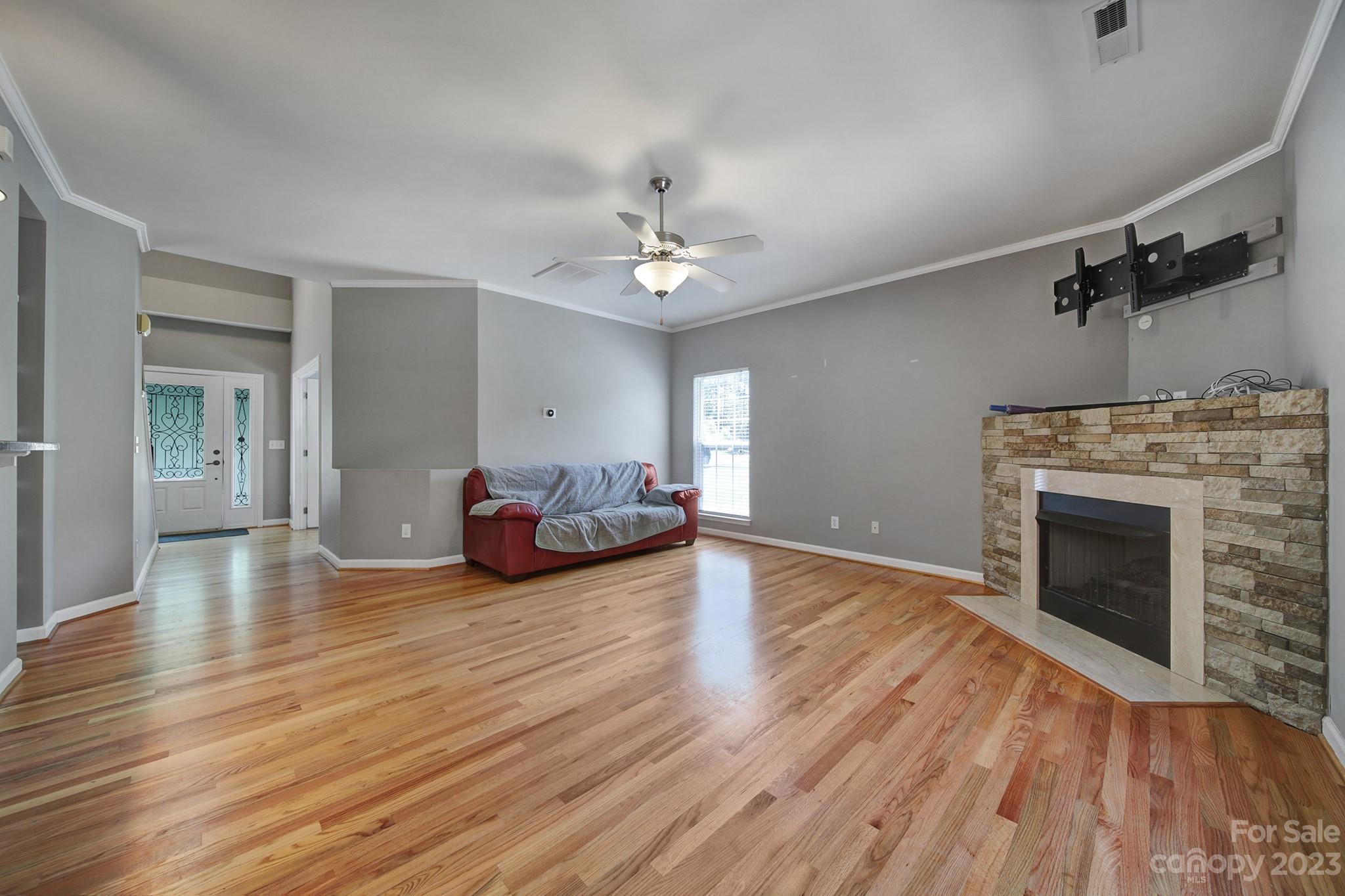 7224 Cascading Pines Drive Tega Cay, SC 29708 - Photo 15 of 36 a living room with furniture and a fireplace