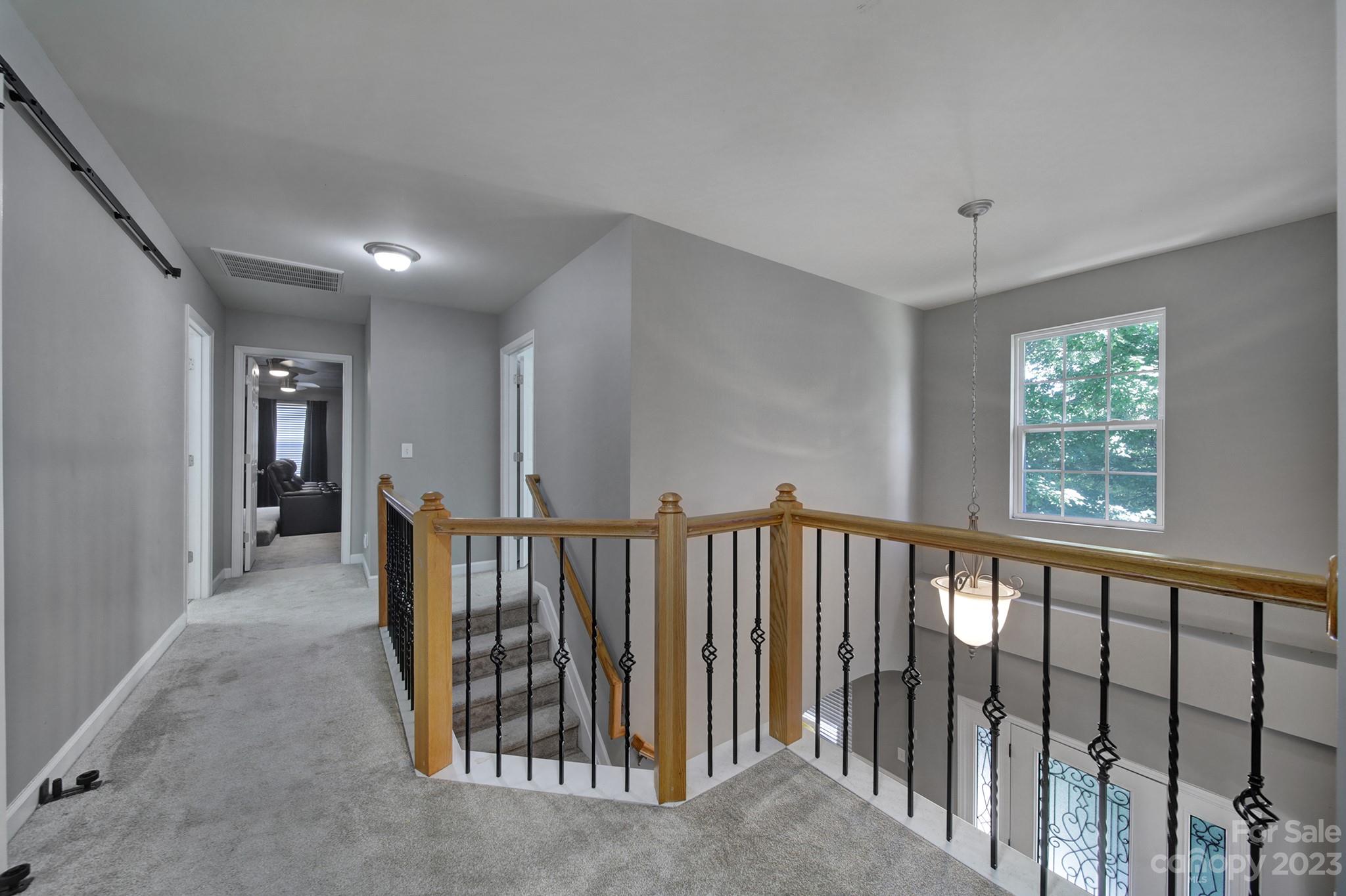 7224 Cascading Pines Drive Tega Cay, SC 29708 - Photo 17 of 36 a view of hallway with windows