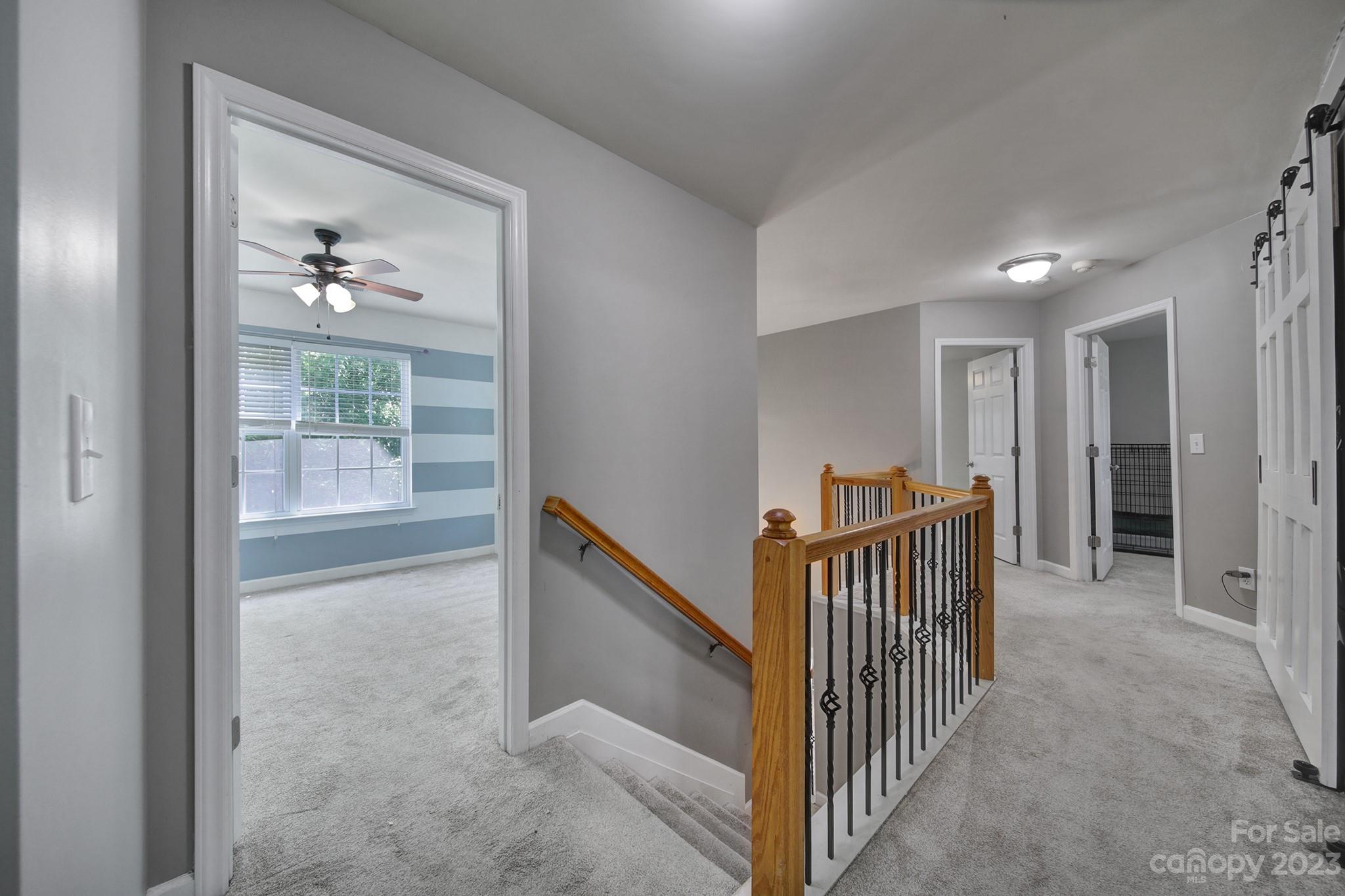 7224 Cascading Pines Drive Tega Cay, SC 29708 - Photo 18 of 36 a view of livingroom with furniture and stairs