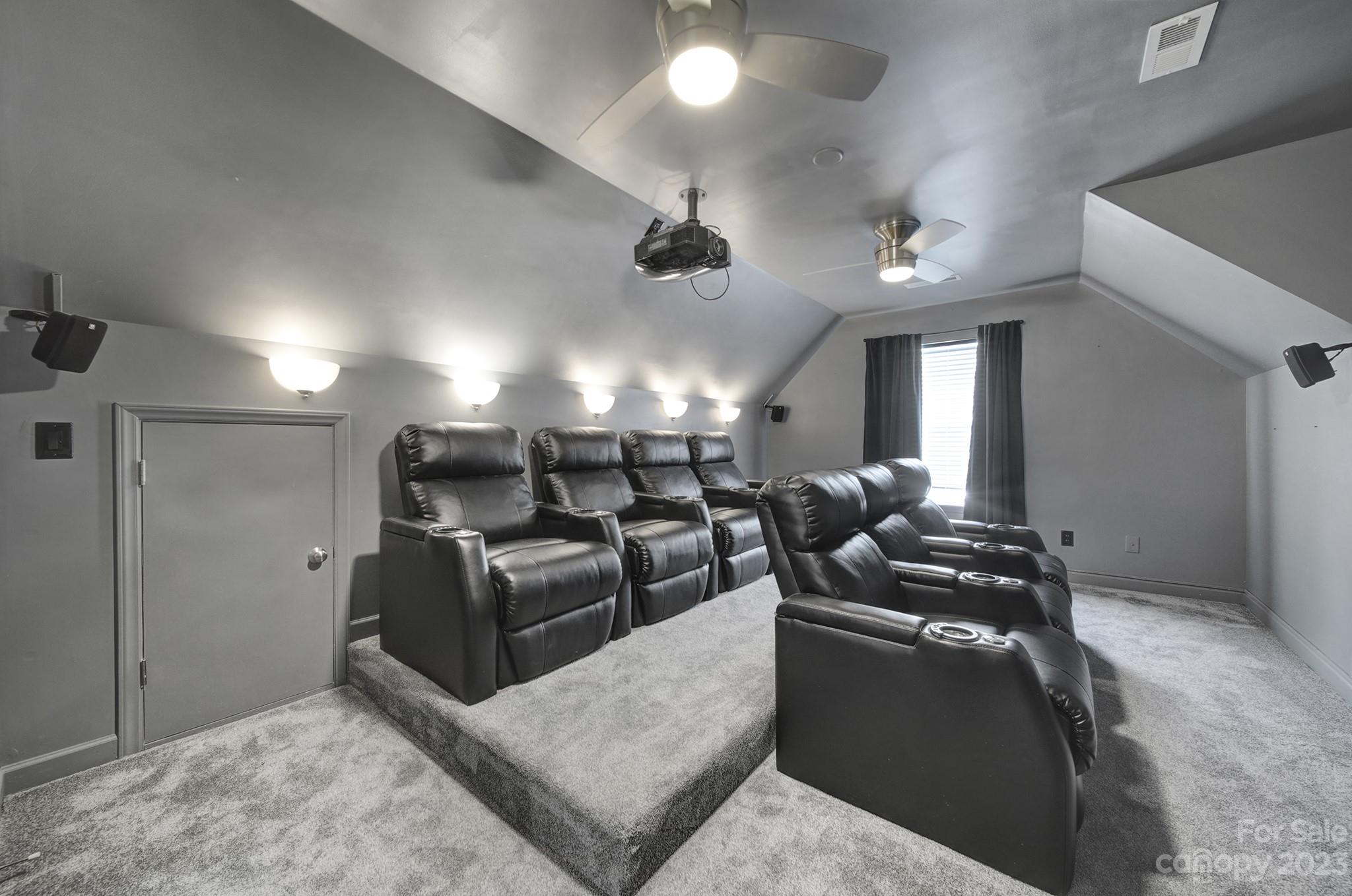 7224 Cascading Pines Drive Tega Cay, SC 29708 - Photo 27 of 36 a living room with furniture and a chandelier