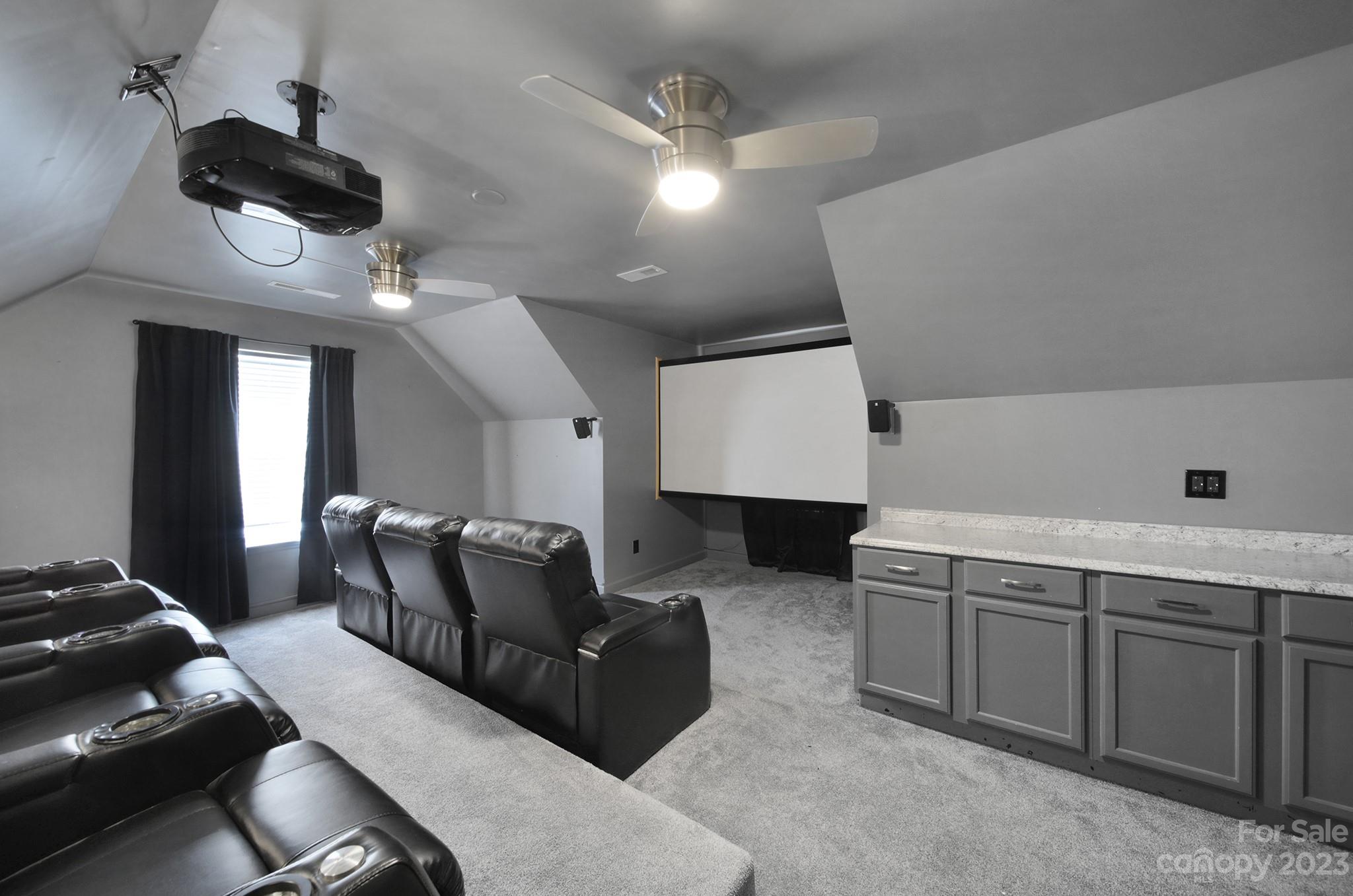 7224 Cascading Pines Drive Tega Cay, SC 29708 - Photo 28 of 36 a living room with furniture and a ceiling fan