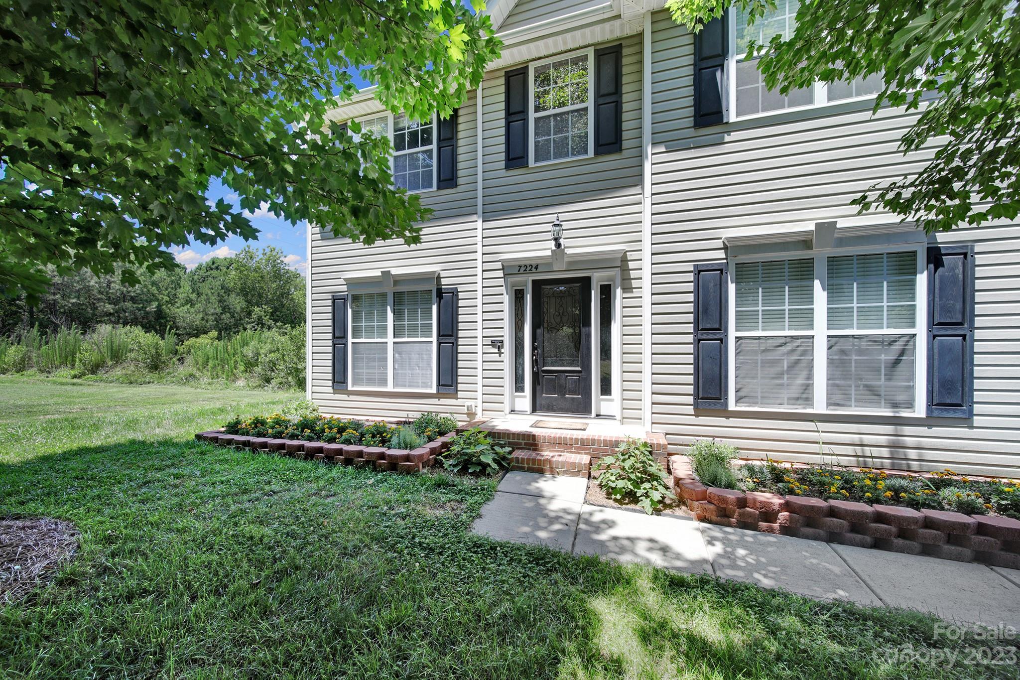 7224 Cascading Pines Drive Tega Cay, SC 29708 - Photo 3 of 36 a front view of a house with a yard