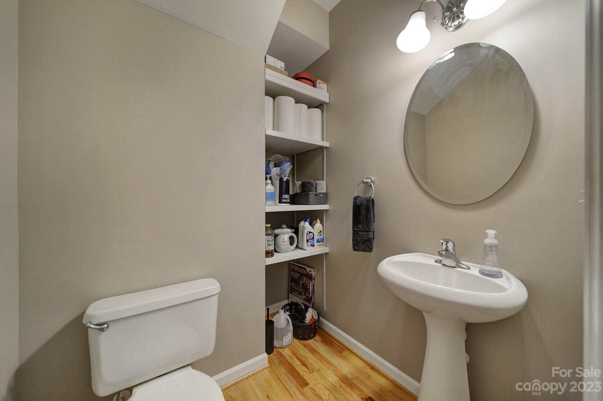 7224 Cascading Pines Drive Tega Cay, SC 29708 - Photo 31 of 36 a bathroom with a sink a toilet and a mirror