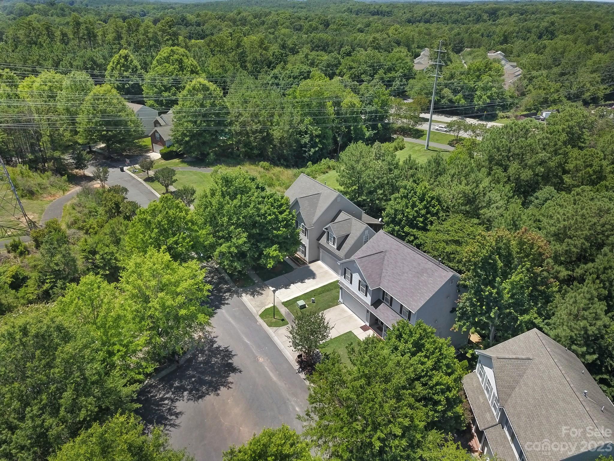7224 Cascading Pines Drive Tega Cay, SC 29708 - Photo 36 of 36 an aerial view of a house with a yard