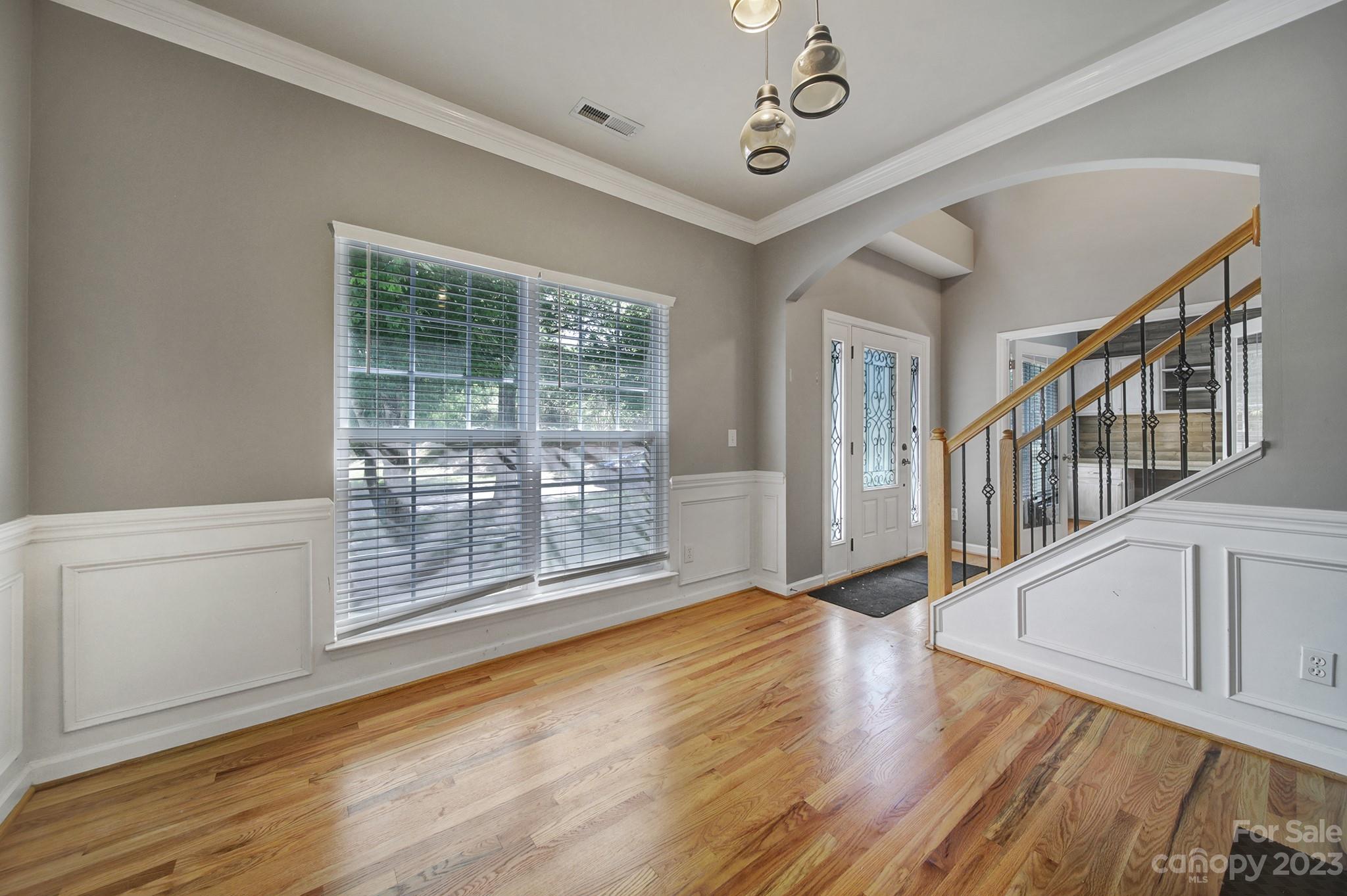 7224 Cascading Pines Drive Tega Cay, SC 29708 - Photo 5 of 36 a view of an empty room with wooden floor and a window