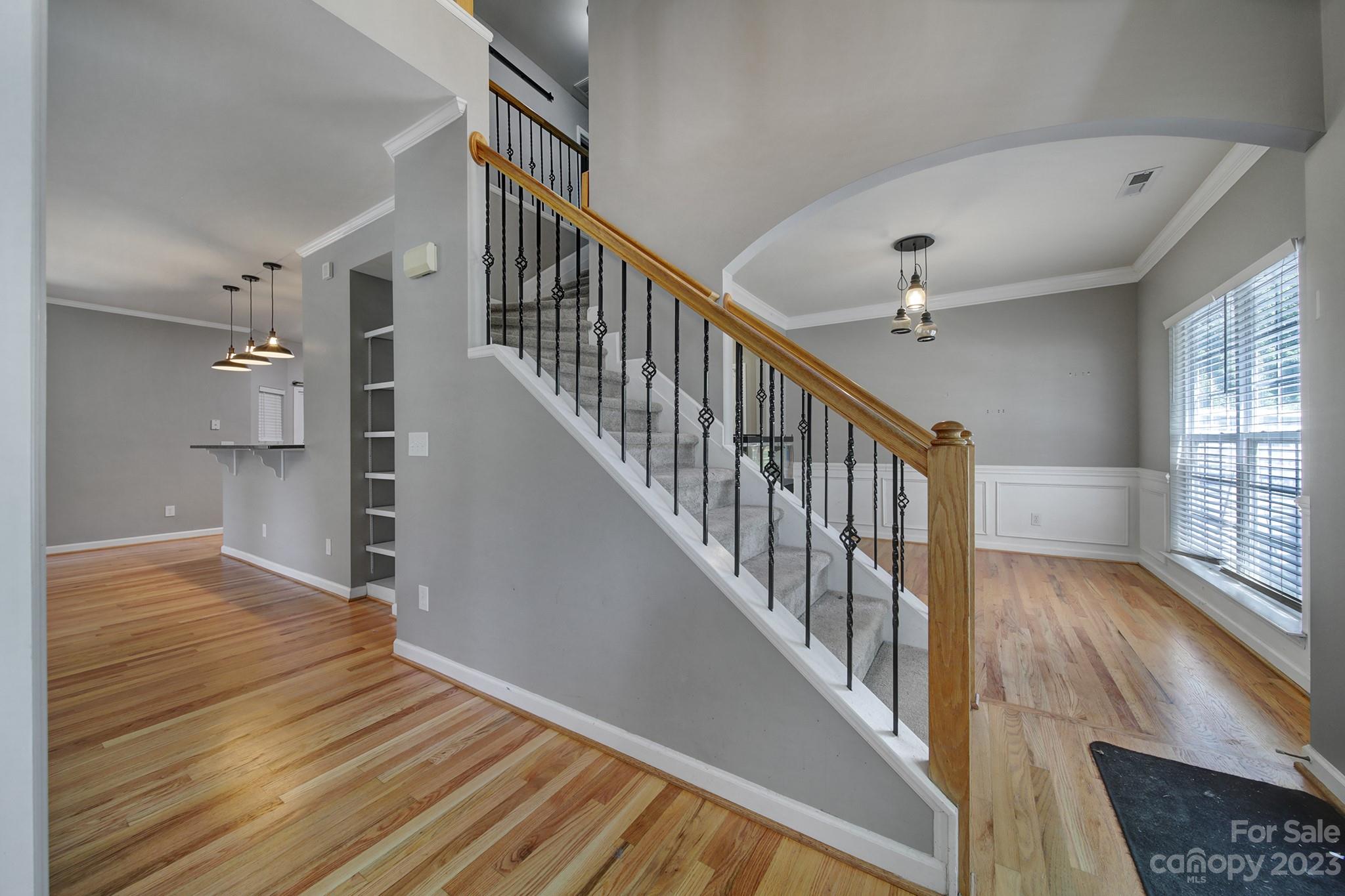 7224 Cascading Pines Drive Tega Cay, SC 29708 - Photo 7 of 36 a view of entryway and hall with wooden floor