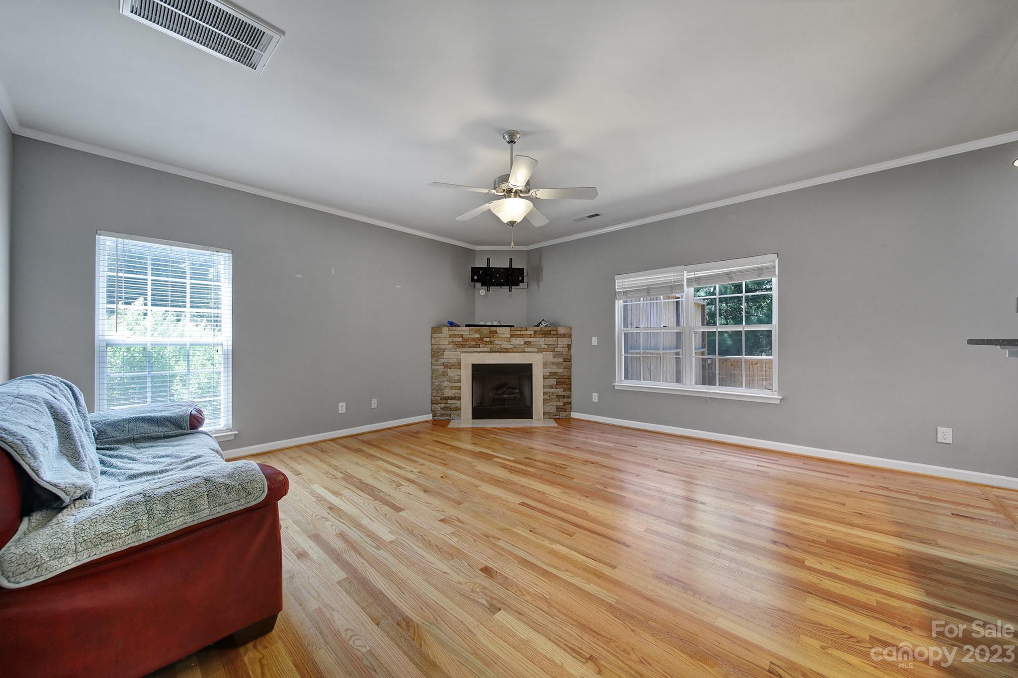 7224 Cascading Pines Drive Tega Cay, SC 29708 - Photo 8 of 36 a living room with furniture and a fireplace