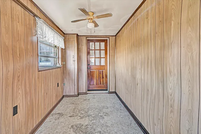 a view of a hallway with a window