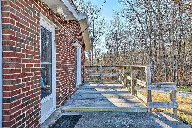 a view of a balcony with wooden floor
