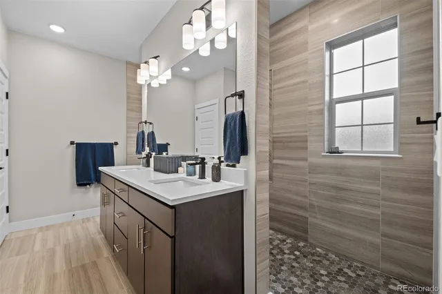 a bathroom with a sink a vanity and a mirror